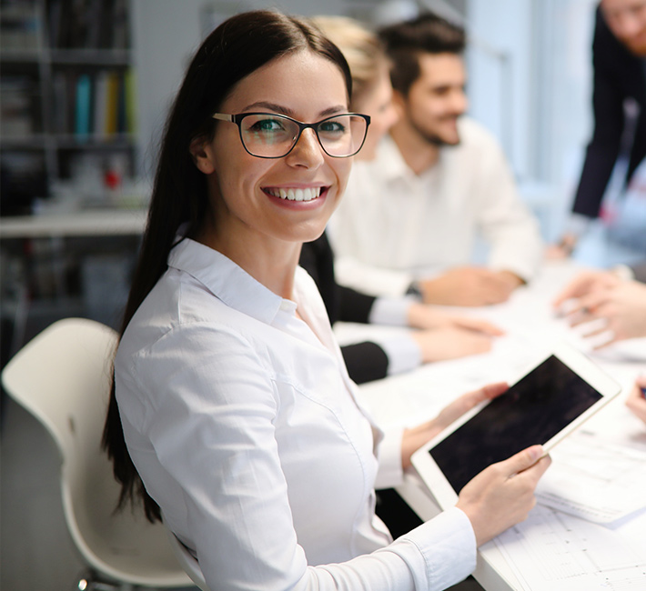 Woman smiling with her Ipad