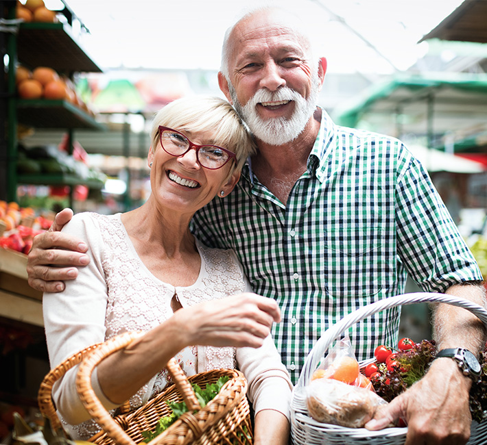 Man and wife shop at farmers market